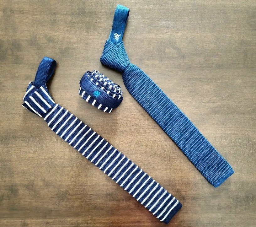 Cravatte in maglia blu e a righe della capsule Malaghèna